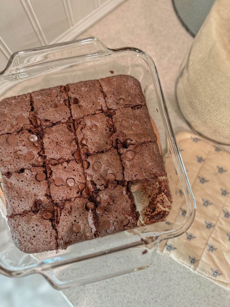 Baked brownies with freshly milled flour in pan on counter next to pot holder